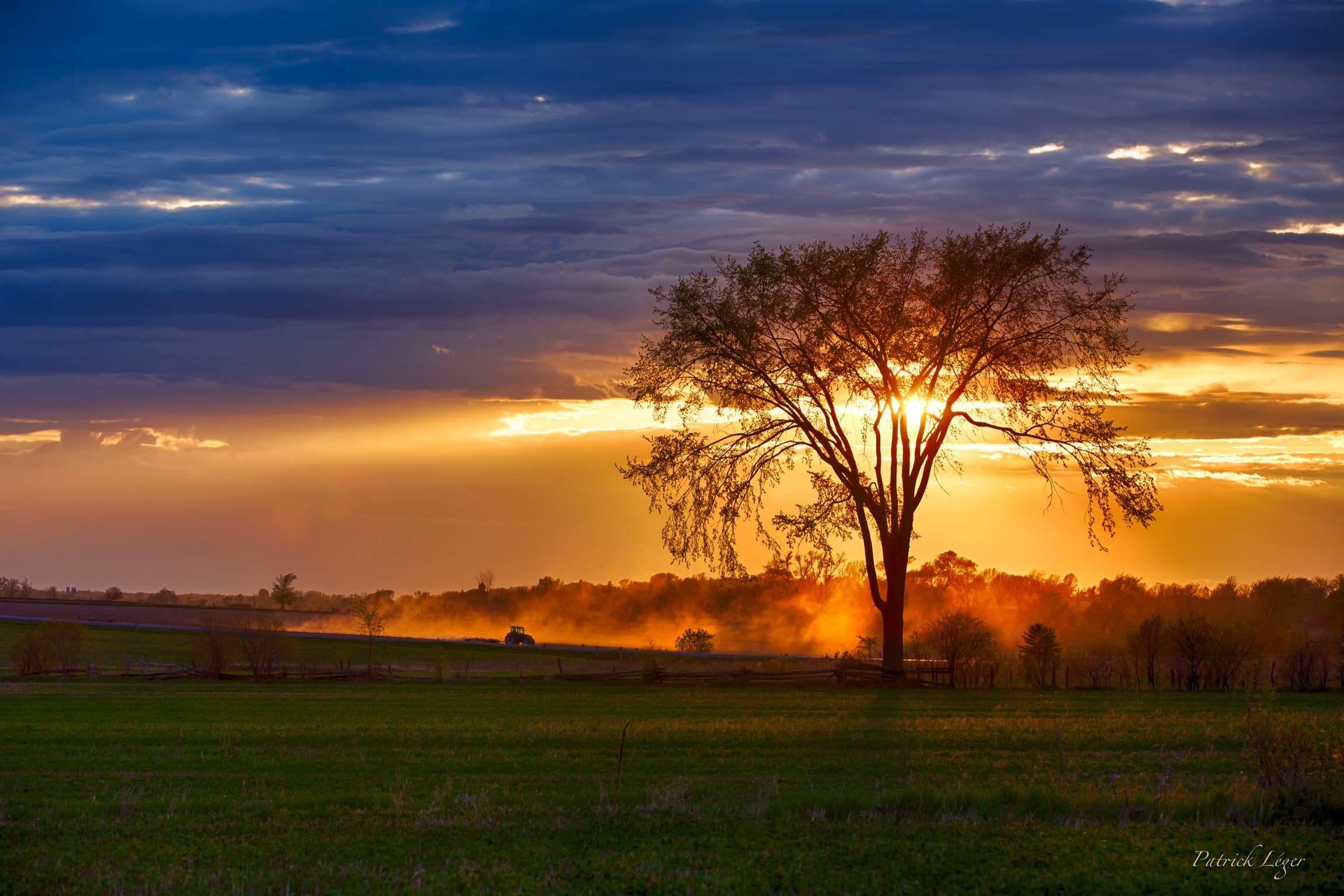 Dusty Tractor Sunset